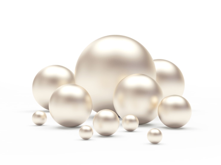Photo groupe de perles blanches de tailles différentes