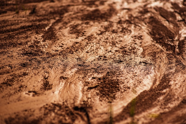 Grunge gros plan détaillé texture argile humide Boue humide avec des gouttes de pluie du soleil La surface de Mars