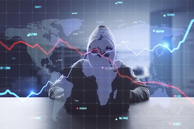 Hacker au bureau utilisant des ordinateurs avec un hologramme de carte bleu brillant créatif avec graphique et grille sur fond intérieur de bureau flou Économie piratage monde et concept de stock Double exposition