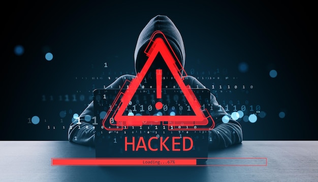 Hacker in hoodie with red warning exclamation icon and HACKED alert on digital screen in dark background with binary code and loading bar