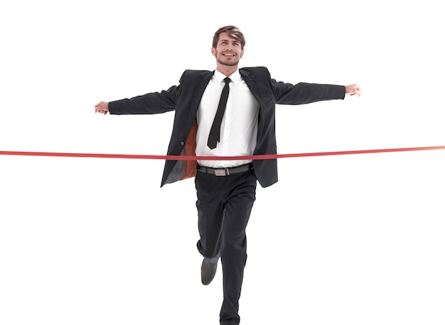 Happy businessman crossing ligne d'arrivée sur fond blanc