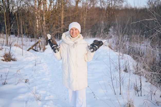 Happy senior senior woman in white outwear chaud