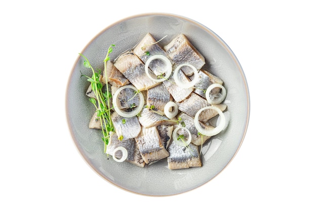 Hareng salé dans une assiette de fruits de mer poisson repas sain collation sur la table copie espace nourriture