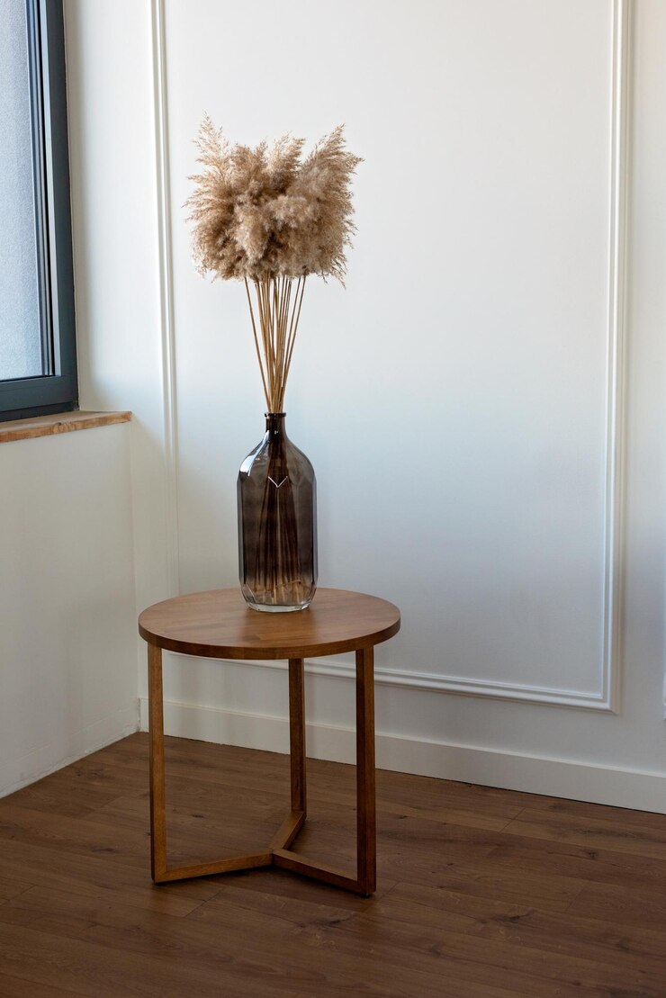 Photo herbe de pampa naturelle séchée dans un vase en verre élément de décor intérieur fond boho minimalisme dans la conception décor écologique mise au point sélective douce