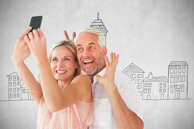 Photo heureux couple posant pour un selfie sur fond blanc