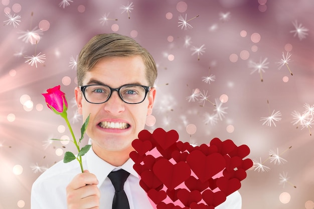 Hipster geek romantique contre les graines de pissenlit générées numériquement sur fond rose