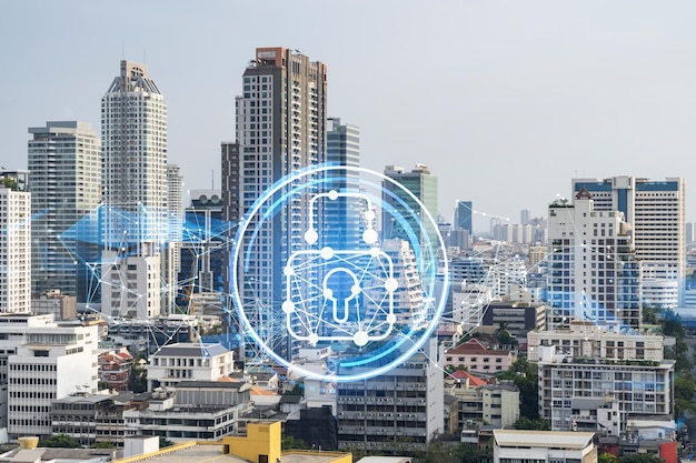 Hologramme d'icône de cadenas sur la vue panoramique sur la ville de Bangkok pour protéger les entreprises en Asie du Sud-Est Le concept de protection de la sécurité de l'information Double exposition