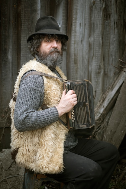 Photo homme adulte bouclé avec une barbe