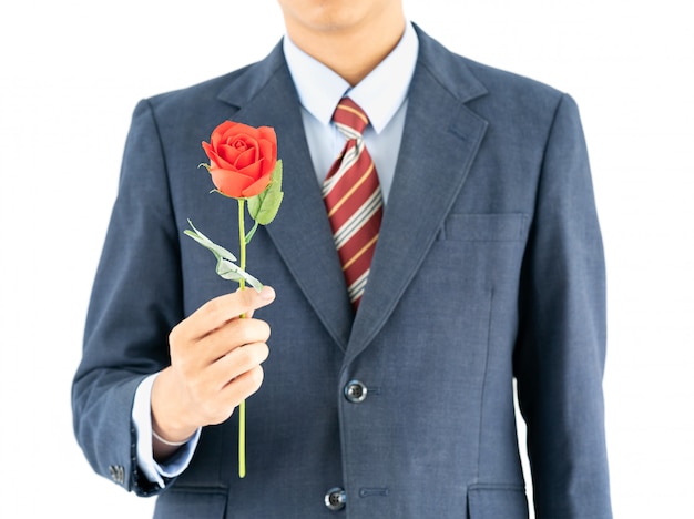 Homme d&#39;affaires en costume avec rose rouge sur blanc