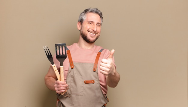 Homme de chef d'âge moyen. concept de barbecue