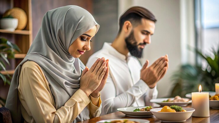Photo un homme et une femme prient à une table avec de la nourriture