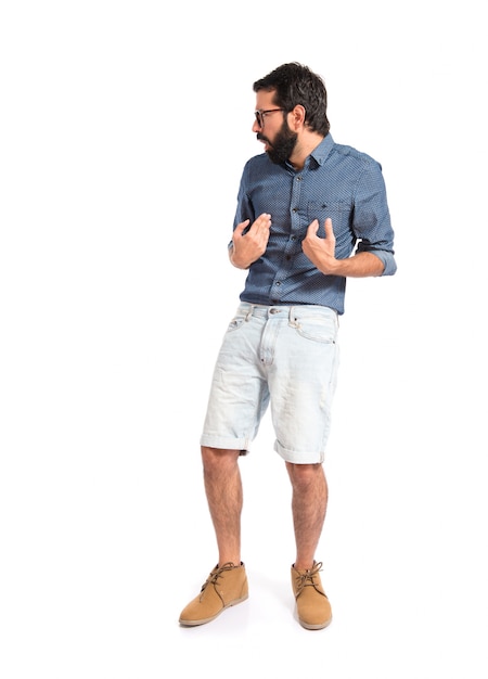 Homme jeune hipster, faisant un geste de surprise