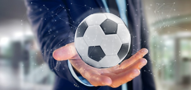 Homme tenant un ballon de football et connexion isolée rendu 3d