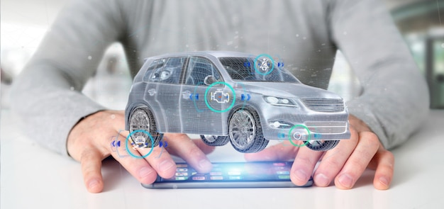 Un homme tenant une Smartcar avec des contrôles 3D