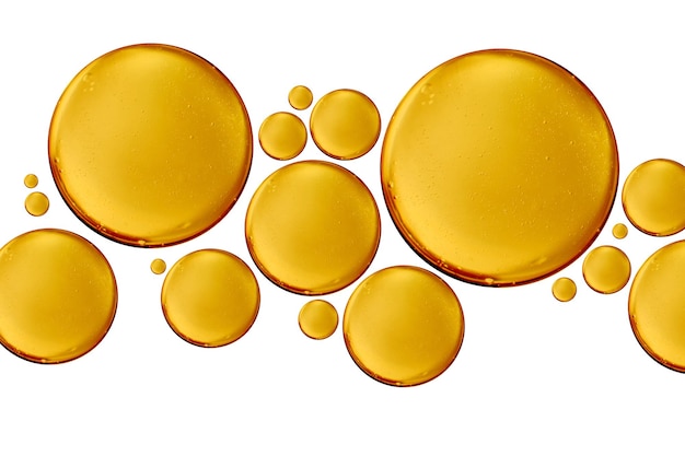 Photo huile de vitamine bulle jaune doré ou sérum de soin de la peau isolé sur fond blanc concept d'ingrédient cosmétique ou spa