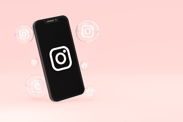 Photo l'icône instagram sur le smartphone à l'écran ou les réactions mobiles et instagram aiment le rendu 3d sur fond rose