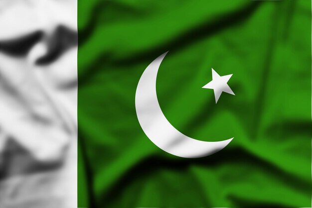 Photo il agite le drapeau du pakistan.