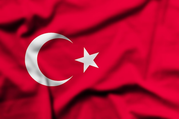 Photo il agite le drapeau de la turquie.