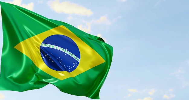 Illustration 3d du drapeau du brésil sur un tissu brillant ondulé sur fond de ciel bleu avec un nuage blanc