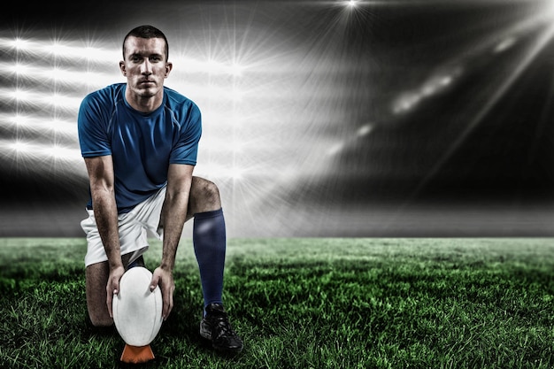 Photo image composée du portrait intégral du joueur de rugby plaçant la boule et 3d