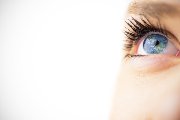 Image composite de close up of female blue eye