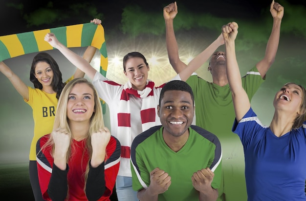 Image composite de divers fans de football contre un terrain de football sous un ciel vert et des projecteurs