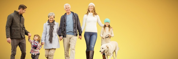 Image composite de famille heureuse marchant avec leur chien