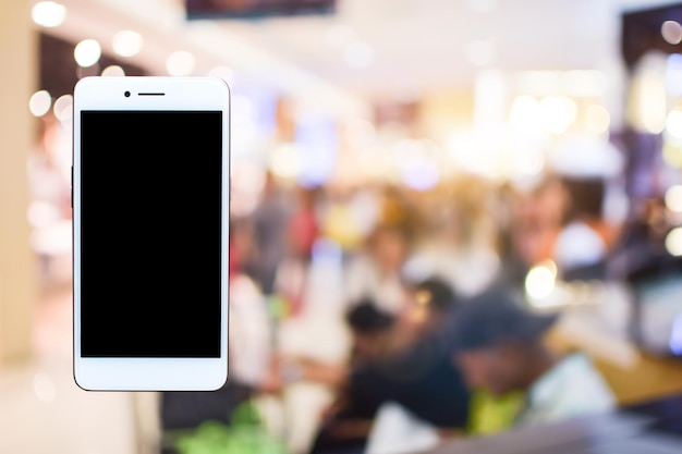 Photo image composite numérique d'un téléphone portable en l'air dans un restaurant