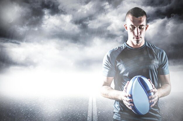 Photo image composite de rugby player holding ball