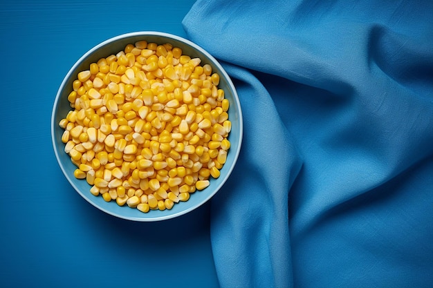 Image IA générative de grains de maïs dans un bol avec un chiffon sur fond bleu