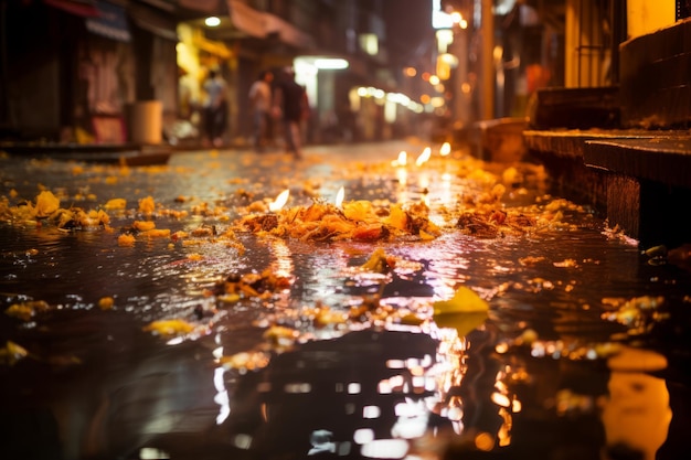 une image d'une rue la nuit avec des bougies allumées au sol