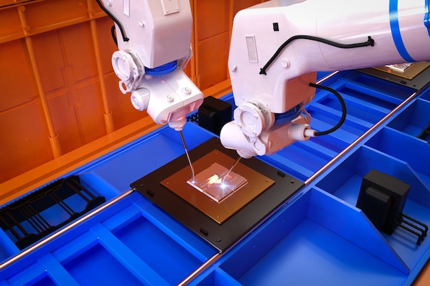 Photo industrie de l'automatisation avec chaîne de montage de robots en usine
