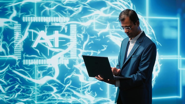 Un informaticien utilisant un ordinateur portable pour mettre en œuvre l'intelligence artificielle