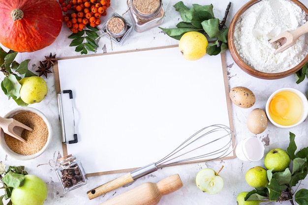 Ingrédients alimentaires pour faire une tarte à la citrouille d'automne sur fond de pierre blanche concept de cuisson maison vue supérieure espace de copie