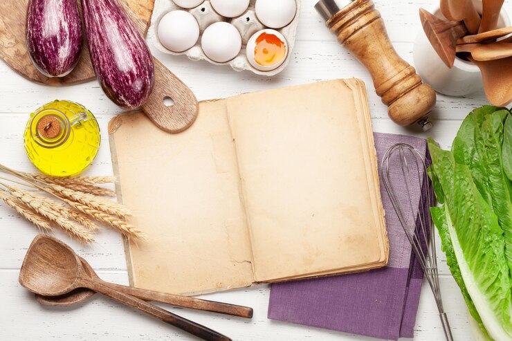 Ingrédients d'ustensiles de cuisine et livre de cuisine