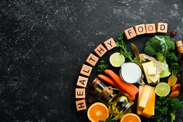 Inscription d'aliments sains sur la photo Ensemble de légumes fruits et aliments Vue de dessus Espace libre pour votre texte