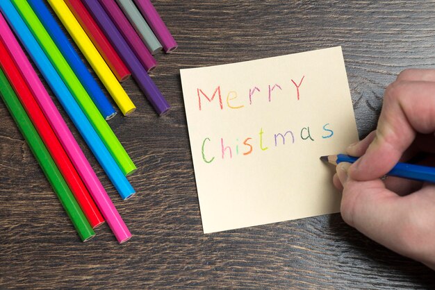 Photo l'inscription sur le morceau de papier joyeux noël