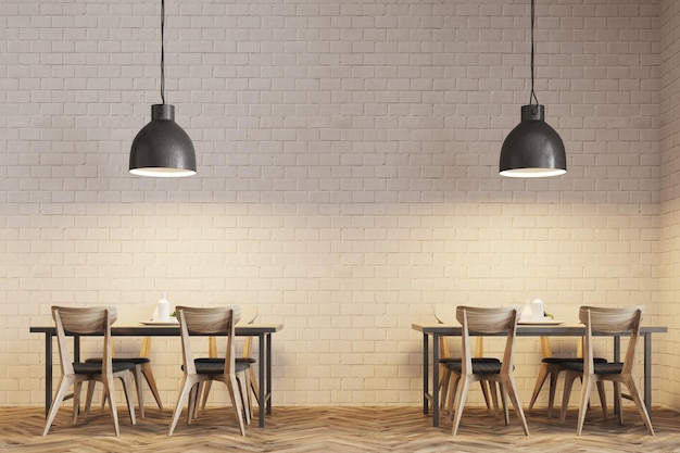 Intérieur de café moderne avec des tables et des chaises en bois près des murs en briques blanches. Lampes de plafond originales. Un gros plan. Rendering 3D mock up