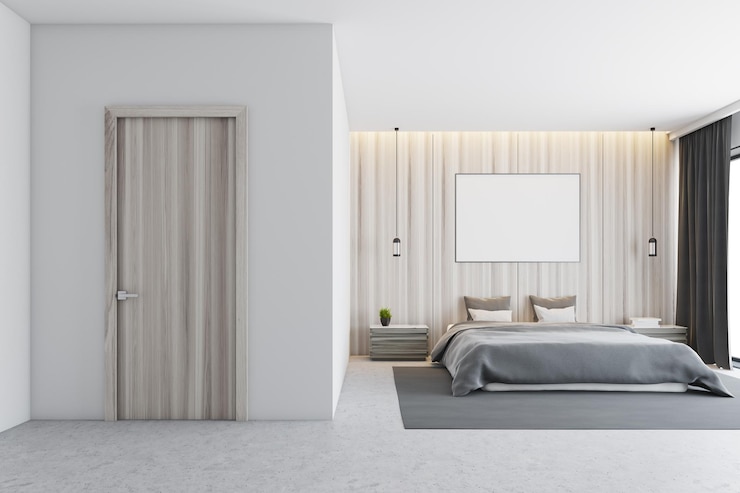 Photo l'intérieur de la chambre en bois avec un sol en béton, un lit principal avec une affiche suspendue au-dessus et des fenêtres panoramiques.