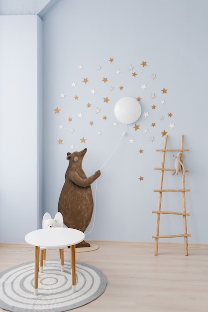 Photo l'intérieur de la chambre des enfants est décoré dans des tons bleus et beiges