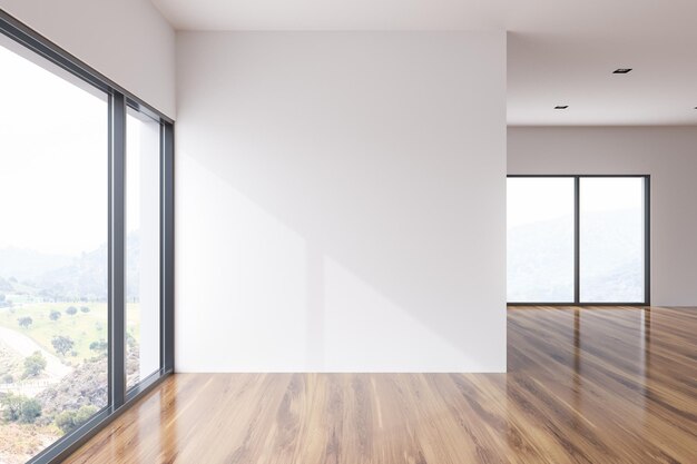 Intérieur de la chambre vide loft mur blanc avec un plancher en bois et une fenêtre panoramique avec vue sur la prairie de montagne. Concept de publicité et de marketing. maquette de rendu 3d