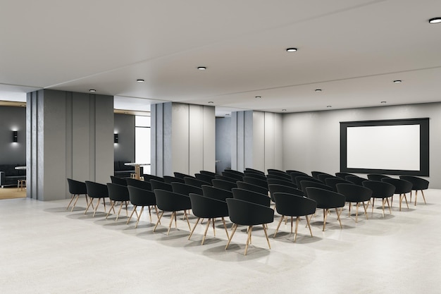 Intérieur contemporain d'une salle de présentation avec chaises et écran vide