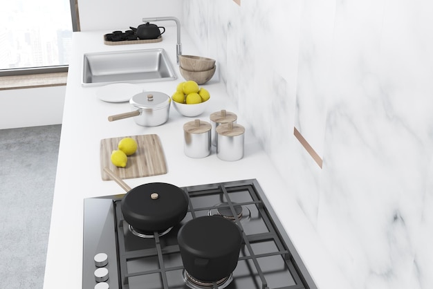 Intérieur de cuisine en marbre blanc avec un comptoir blanc, une cuisinière et un évier. Une vue de dessus. Concept de cuisine maison. maquette de rendu 3d