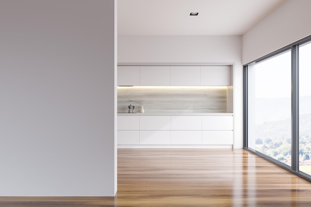 Intérieur de cuisine à mur blanc avec comptoirs blancs, appareils encastrés et fenêtres panoramiques. rendu 3d Une maquette de mur sur la gauche