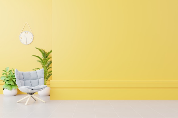 Intérieur du salon avec fauteuil en tissu, lampe, livre et plantes sur un mur jaune vide