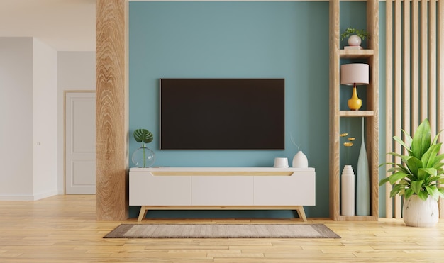 Intérieur du salon avec TV et armoire sur fond de mur bleu vide rendu 3D