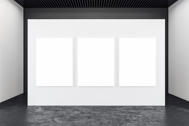 Intérieur d'exposition en béton moderne avec trois bannières vierges