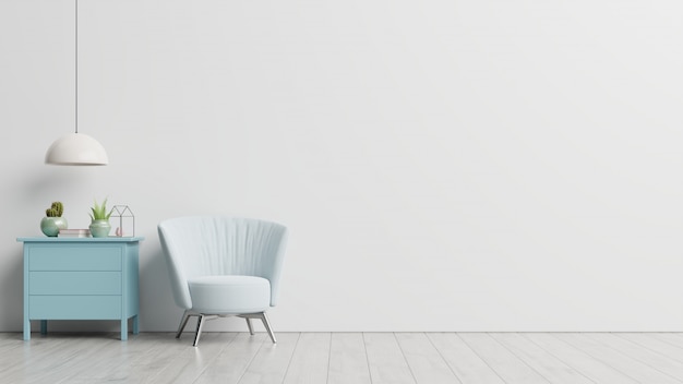 L'intérieur a un fauteuil sur un mur blanc vide