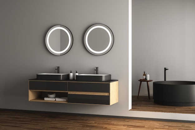 Intérieur de salle de bain moderne avec parquet marron foncé, baignoire blanche et noire et lavabo en marbre.