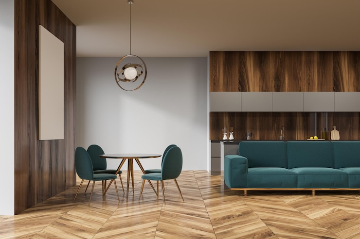 Photo intérieur de salle à manger en bois avec des comptoirs blancs, un canapé vert et une affiche au-dessus d'une table ronde avec des chaises vertes. maquette de rendu 3d